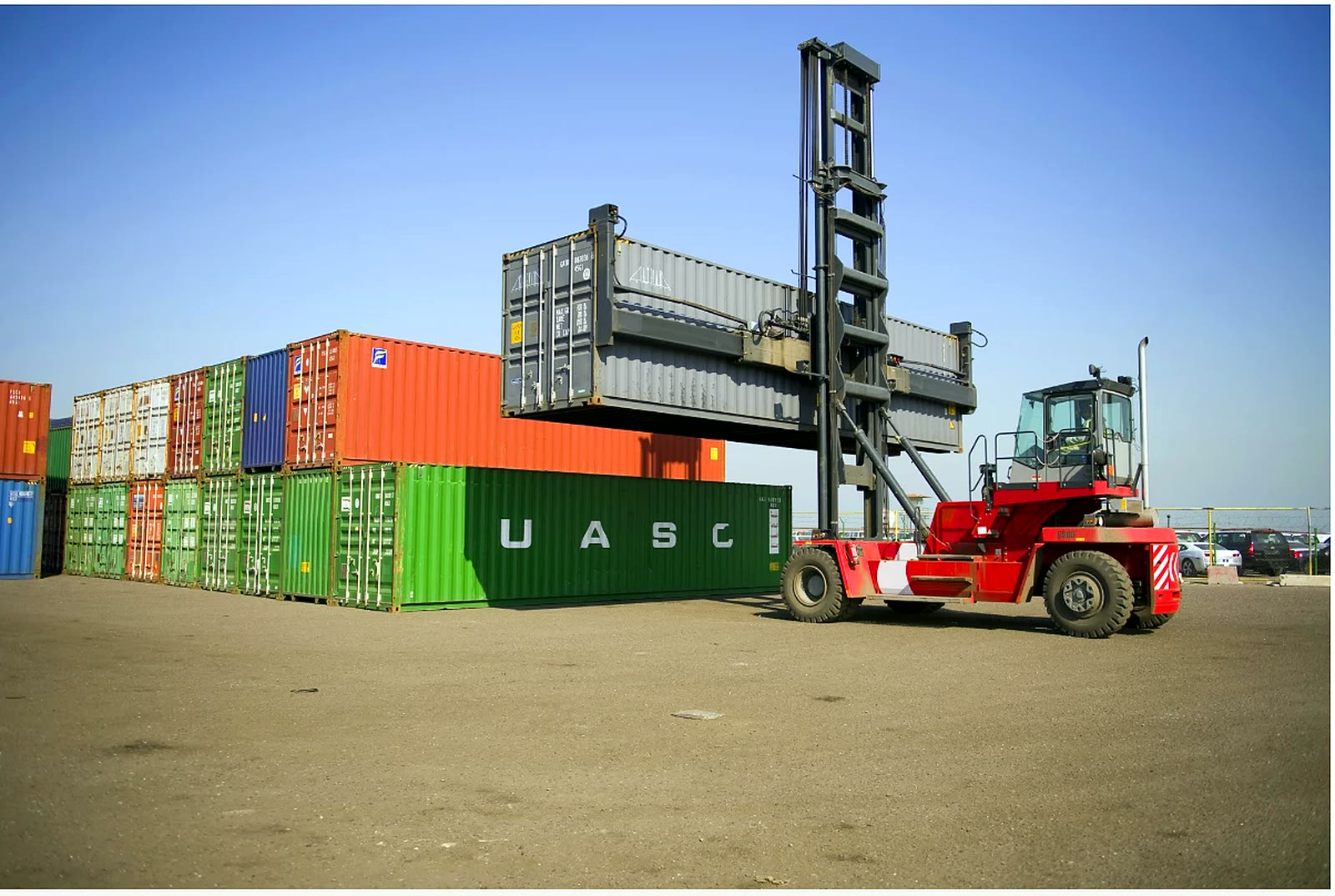 Container handling equipment lifting a container